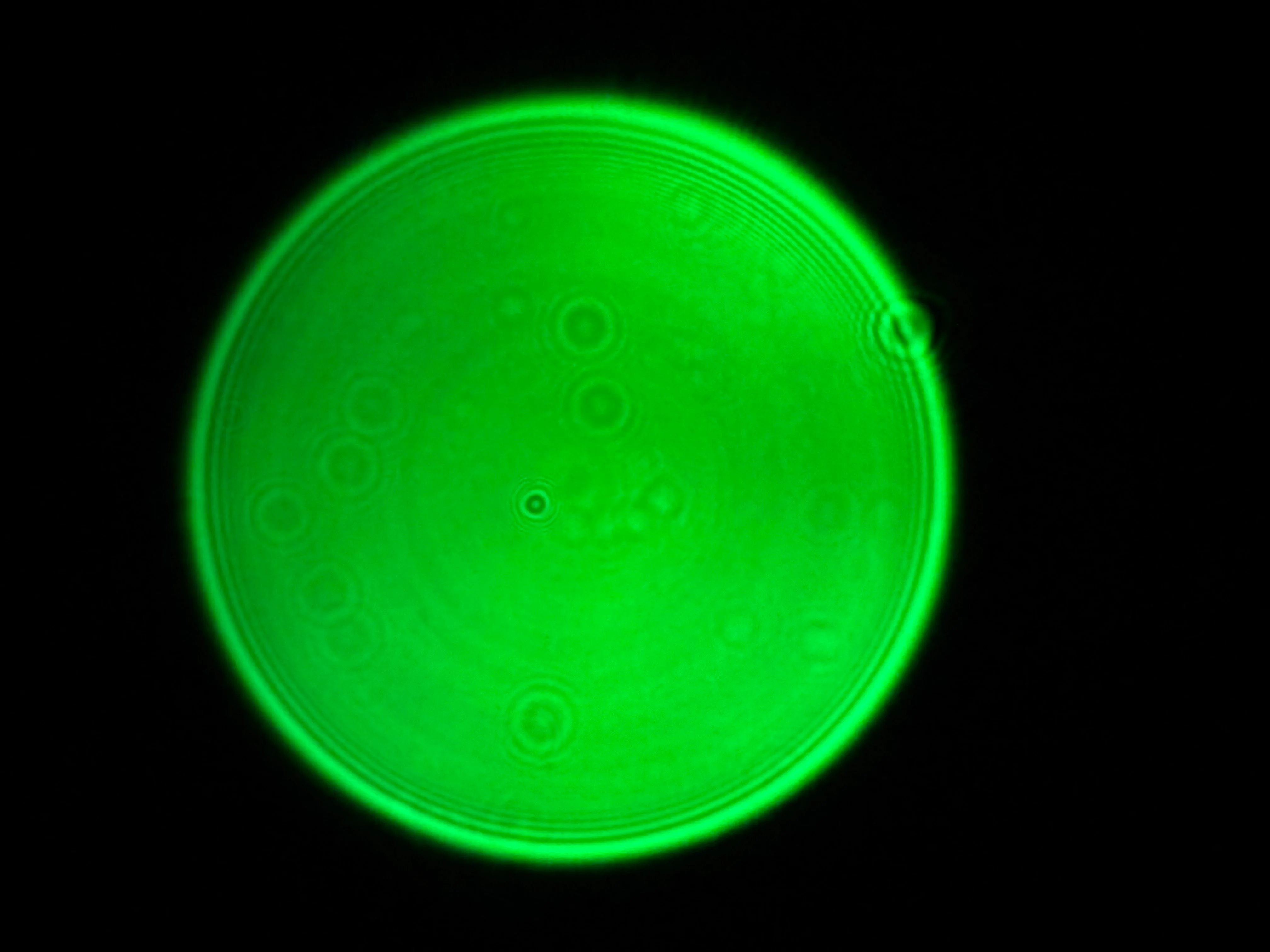 Green LED pinhole light source in operation